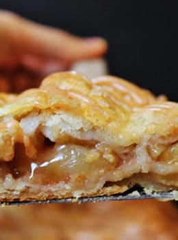 A flaky crust, tender apples, warm spices, it's a delicious handheld pie in slab form, which means you get more crust per bite! It is topped with all the flavors in the pie because it uses all the leftover spiced liquids from the apples!