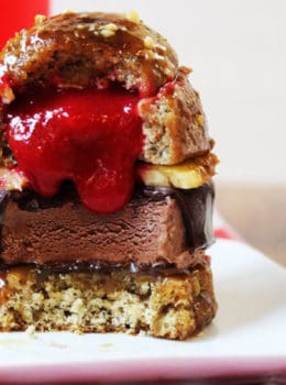 A showstopping dessert with all the flavors of a banana split in the shape of a burger. Strawberry sauce and white chocolate filled banana cake glazed with caramel sauce and topped with crushed peanuts filled with pineapple and a dark chocolate dipped ice cream bar. Your guest's mouths will drop open when they see the dessert and do it a second time when they break into it as see the strawberry sauce "ketchup" spill out.