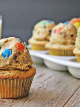 Chocolate Chip Peanut Butter Cupcakes topped with Monster Cream Cheese Cookie Dough Frosting! Full of M&Ms, peanut butter, brown sugar, oats and chocolate chips. Heaven in a bite!