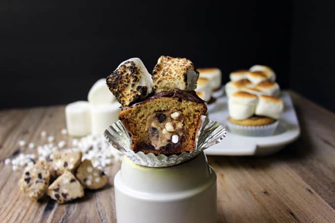 S'mores Cookie Dough Cupcakes - filled with Eggless S'mores Cookie Dough, a Graham Cracker Cake, Chocolate Ganache, and Toasted Marshmallow on top. Summer in a cupcake!
