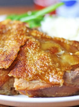 A foolproof EASY slow cooker and oven method for a shatteringly crisp Pork picnic shoulder that is pull apart tender on the inside with a thin crisp cracklin' skin layer.
