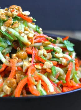 A fresh, crunchy Asian Lime-Peanut Slaw with fresh cucumbers, carrots and bell peppers. Seasoned with sesame oil, lime juice and peanut butter this dish will make your friends and family think you're a rockstar in the kitchen!