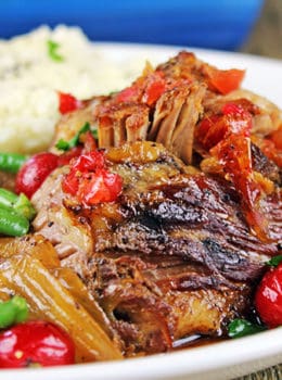 Spicy & Sweet this pork is roasted over onions with chipotle peppers and cherry flavored pop along with some fun maraschino cherries until fork tender. Perfect meal for a main course, tacos, on top of nachos!
