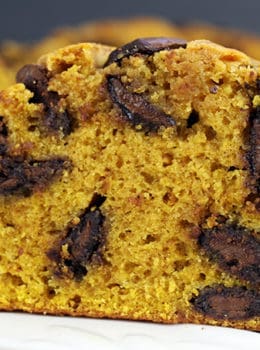 Pumpkin Chocolate Bread filled with delicious Milk Chocolate disks and a perfect breakfast or dessert! This recipe comes together in just a few minutes and doesn't need a mixer to make your house smell like Fall is here!