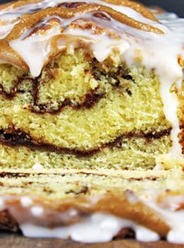 Tender, Rich Cinnamon Roll Pound Cake drenched in Cinnamon Swirl Icing. Easy to make, addicting to eat and perfect for your morning cup of coffee!