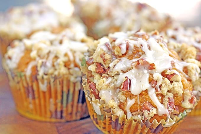 A delicious pumpkin muffin topped with a pecan streusel crunch and drizzled with a maple icing. It is all the amazing flavors of fall all rolled in to a delicious breakfast treat.