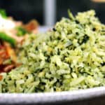 You'll feel like you've sat down to a meal in your favorite mexican restaurant with this slightly spicy Green Mexican Rice made with Cilantro, Jalapeno, Garlic, Spinach and chicken stock. 2 minutes in the extra prep added to your normal rice and you'll LOVE the added flavor!