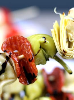 Italian Antipasto Skewers: The spice of the pepperoni, the sweet vinegar of the balsamic glaze, the tender tortellini filled with ricotta and spinach, the briney flavor of the pepperoncini and the artichoke heart. This skewer is going to be a solid contender for favorite bite at your next party!