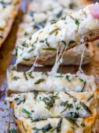 We LOVE this Spinach Artichoke Dip Cheesy Bread