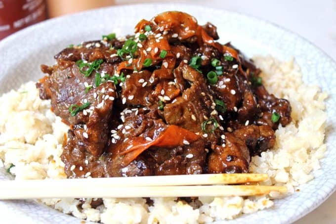 Spicy Tangerine Beef simmered in spicy garlic orange sauce with carrot ribbons. Tastes like a cross between orange beef and Mongolian beef!