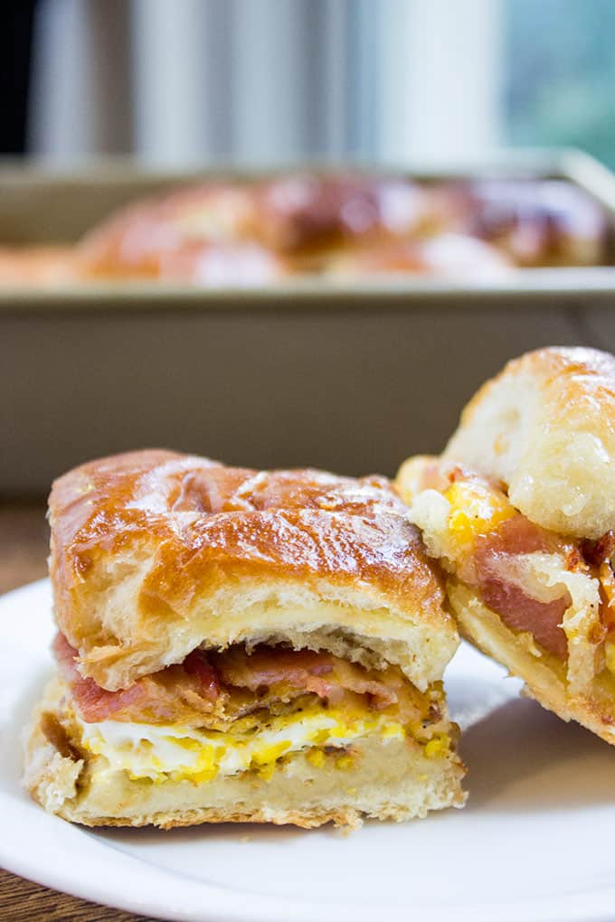 Baked Bacon Egg and Cheese Hawaiian Sliders are quick to make. They're a perfect make ahead and bake the morning of option for get togethers and can quickly serve a crowd!