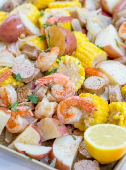 Easy Shrimp Boil recipe with andouille sausage, corn and potatoes is the perfect summer recipe to enjoy the last few weeks of summer before life goes back to normal and most meals aren't served on giant trays and newspaper.