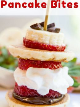 Banana Split Pancake Bites are an easy brunch dish for a party or for your little ones with homemade silver dollar pancakes, Nutella, bananas, strawberries, whipped cream and chocolate chips.