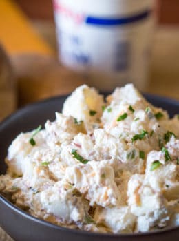 Loaded Baked Potato Salad is cheesy, creamy and ready in just minutes. It makes the perfect side dish to your holiday meal or potluck!
