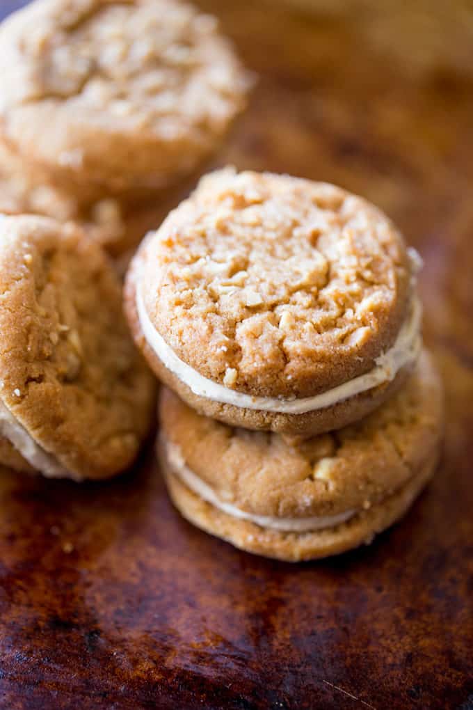 Peanut Butter Do-si-dos Cookie Sandwiches are a Girl Scouts favorite made with peanut butter and oatmeal are sandwiched together with a fluffy soft peanut butter buttercream filling.