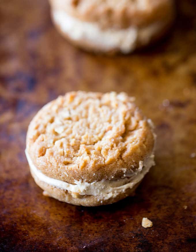 Peanut Butter Do-si-dos Cookie Sandwiches are a Girl Scouts favorite made with peanut butter and oatmeal are sandwiched together with a fluffy soft peanut butter buttercream filling.