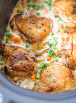 Slow Cooker Crispy Chicken Pot Pie with crispy chicken thighs and all your favorite pot pie vegetables cooked together to make a thick and creamy side dish to the chicken.