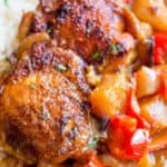 Slow Cooker Hawaiian Pineapple Chicken with crispy chicken thighs, fresh pineapple chunks, onions and bell pepper takes 15 minutes of prep and makes the perfect meal to come home to after a long workday!