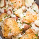 Slow Cooker Garlic Parmesan Chicken and Potatoes takes just a few minutes of prep and five ingredients. Crisp chicken thighs, buttery red potatoes and shaved Parmesan cheese make the perfect easy weeknight meal.