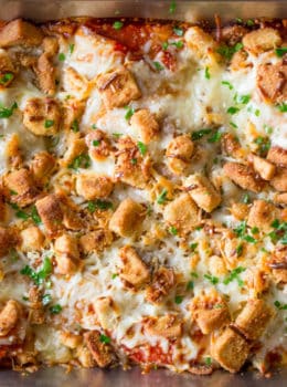 Chicken Parmesan Casserole is a quick weeknight meal that is ready to bake in ten minutes with mozzarella, Parmesan, tomato sauce and a crouton crunch topping for the perfect Chicken Parmesan flavor!