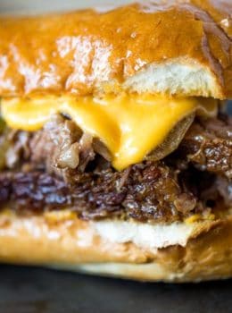Slow Cooker Philly Cheese Steak Sandwiches that are so tender and flavorful you'll feel like you're in Philly. Perfect for a crowd!