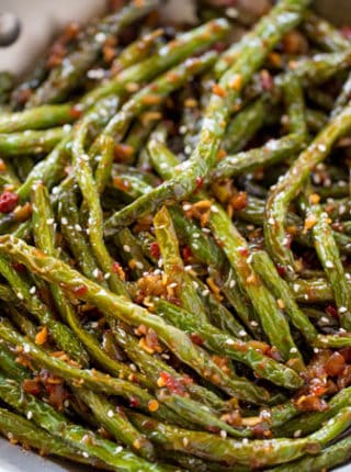 Spicy Sichuan Green Beans are the perfect easy side dish to your favorite Chinese meal and they're a breeze to make with just a few ingredients.