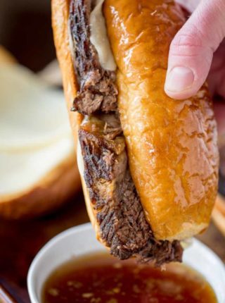 Slow Cooker French Dip Sandwiches are the ultimate sandwich made with your favorite beer with thick slices that are super tender with an amazing crust.