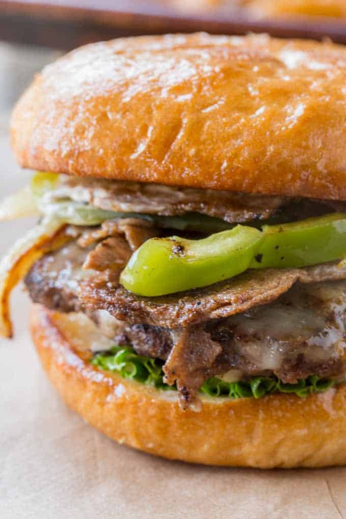 Philly Cheese Steak Burgers made with thinly sliced ribeye and veggies.