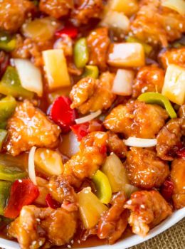 Sweet and Sour Chicken with crispy chicken, pineapple and bell peppers that tastes just like your favorite takeout place without the food coloring.