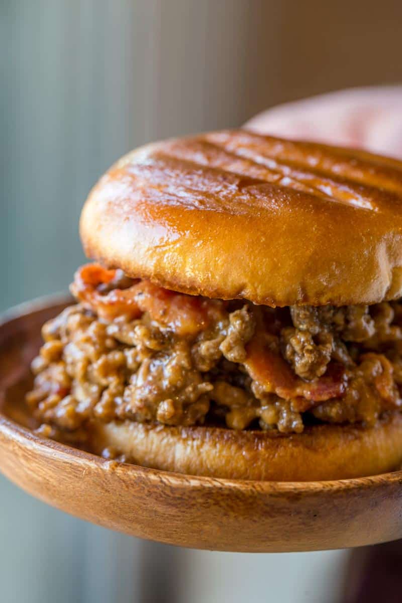 Bacon Cheeseburger Sloppy Joes with ground beef, tomato gravy, cheddar cheese and crisp bacon is the ultimate bacon cheeseburger indulgence!Â 