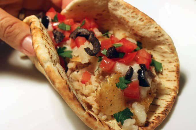 hand holding pita taco 