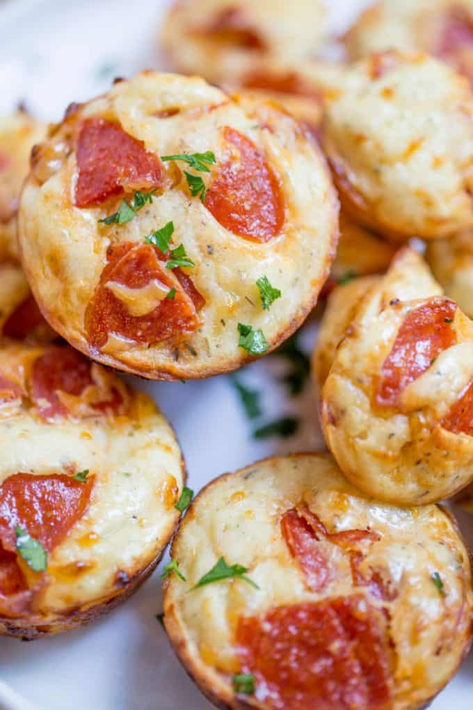 Pepperoni Pizza Bites are a cross between a bagel bite and a pizza muffin and they're ready to bake in just a few minutes.