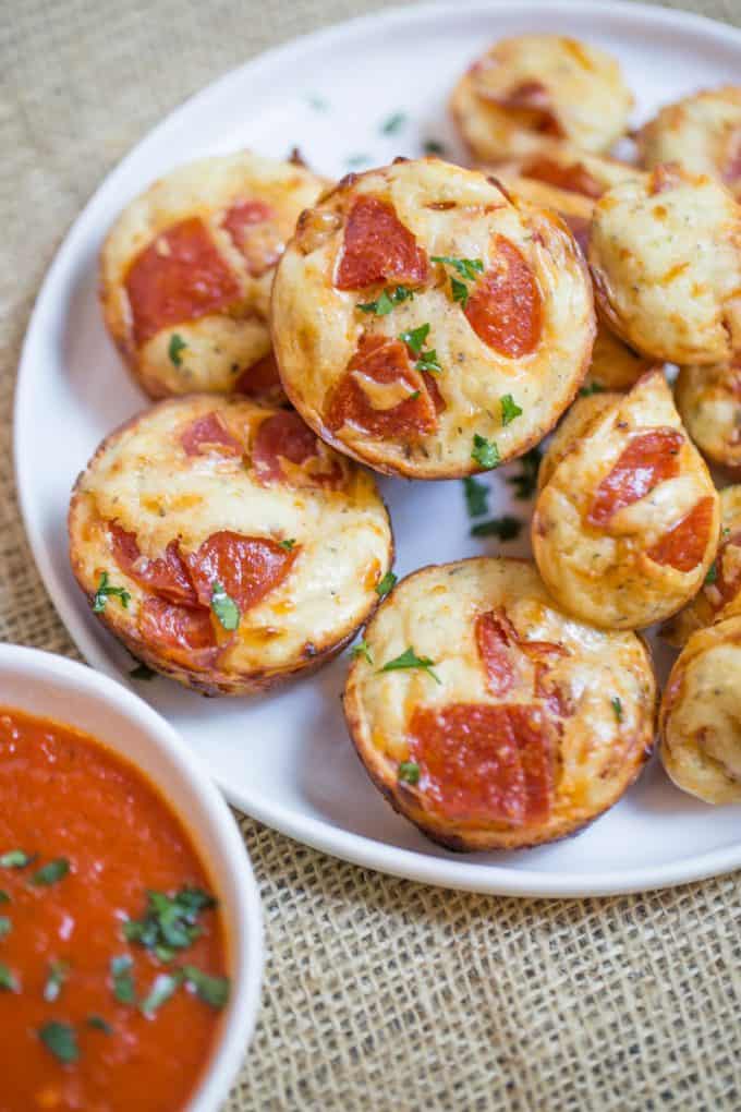 Pepperoni Pizza Bites are a cross between a bagel bite and a pizza muffin and they're ready to bake in just a few minutes.