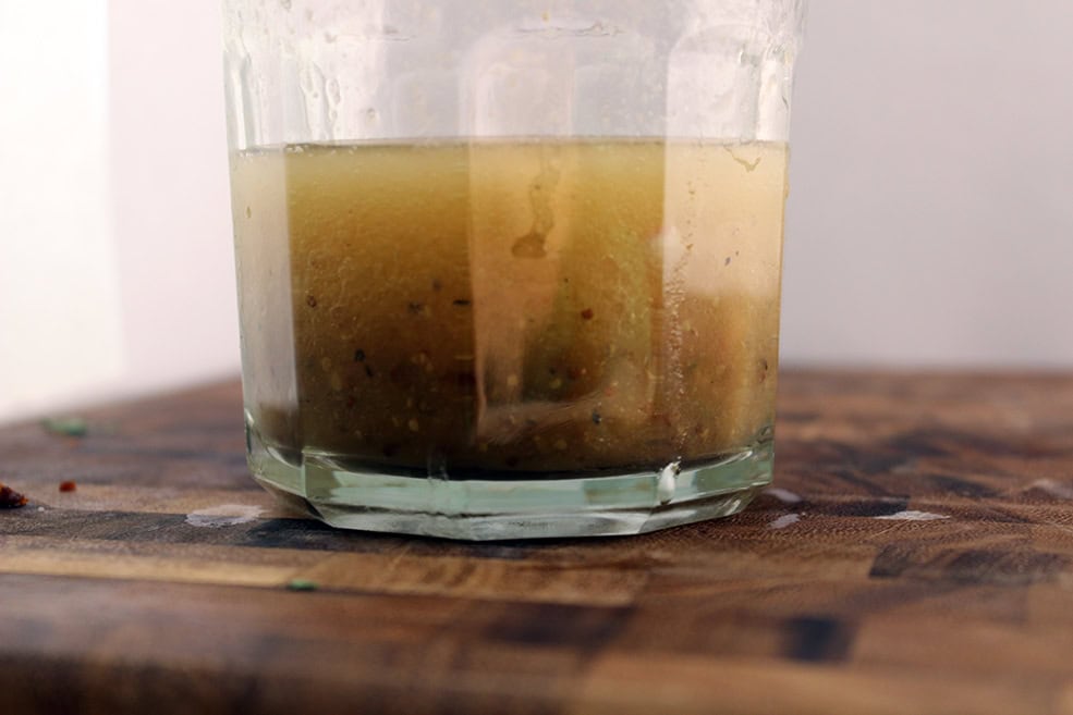 glass with vinaigrette in it 