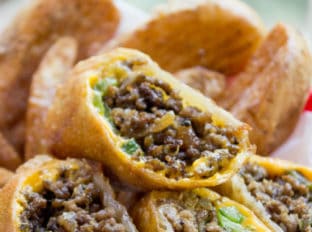 Cheesesteak Egg Rolls have all the flavors of the classic Philly Cheese Steak Sandwich in a crispy shell and made with ground beef! So easy to make and they taste...AMAZING.