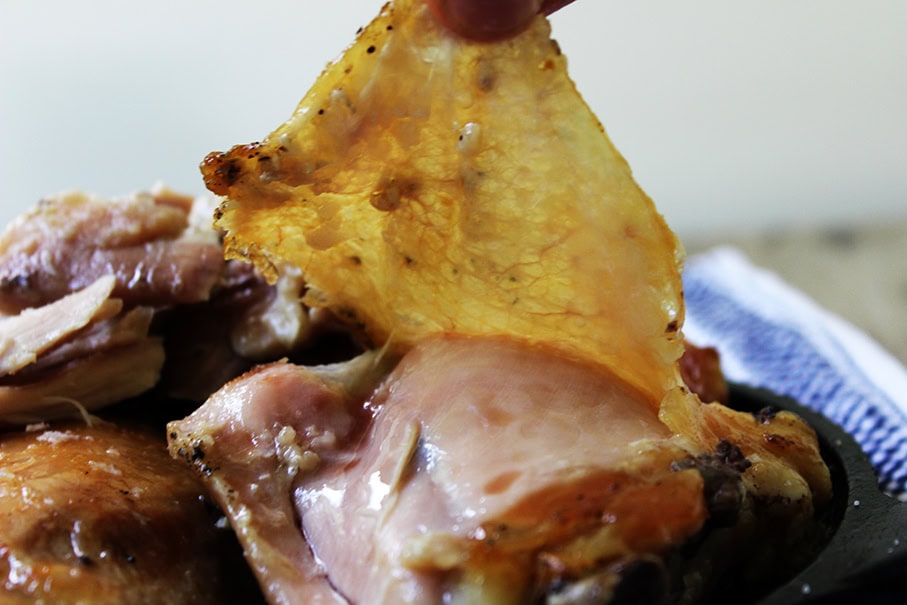 picture of chicken with skin being lifted 