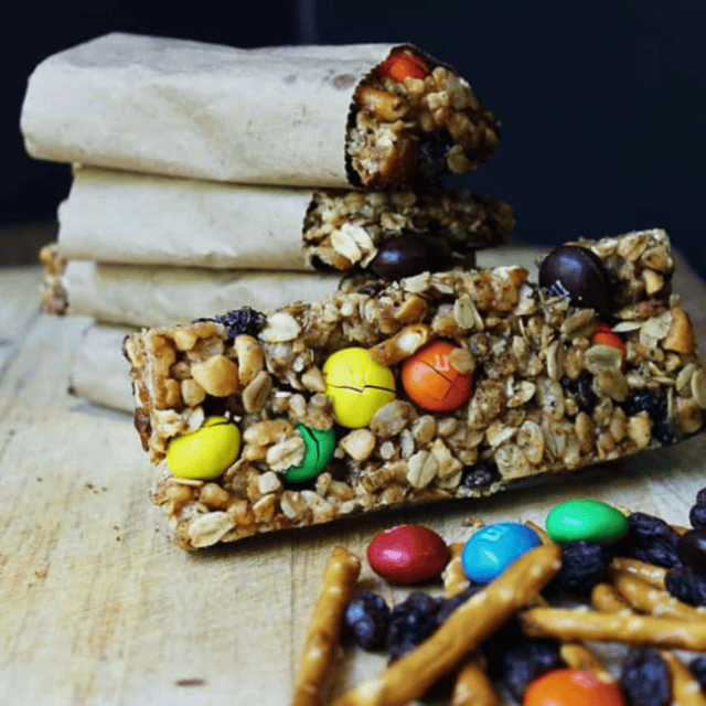Granola bar with bars stacked in the background