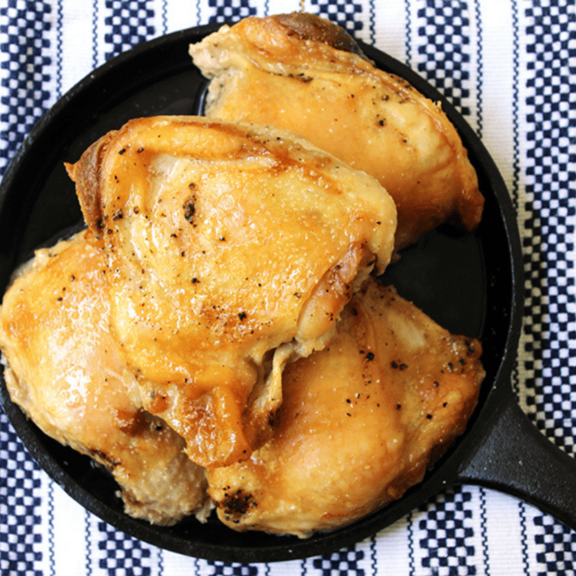 chicken plated on a cast iron skillet