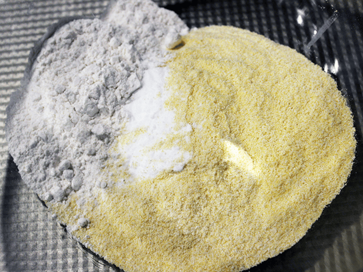dry cornmeal pancake ingredients in a bowl