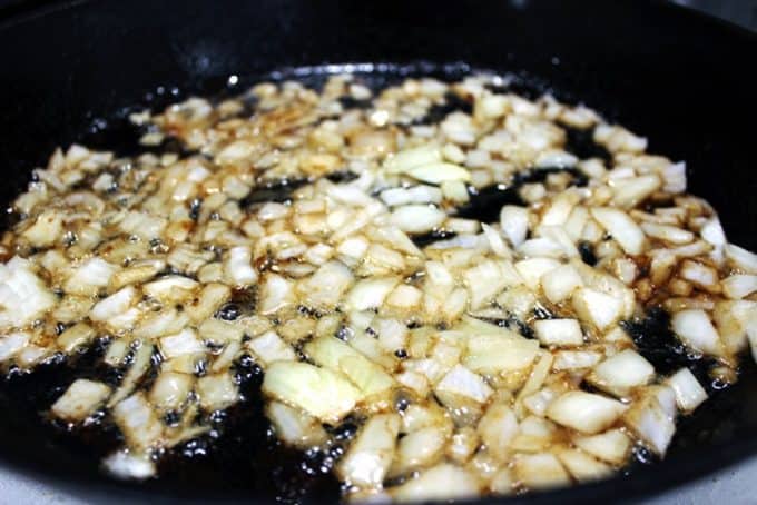 cooking onions in a pan