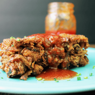 Served on plate with BBQ sauce and parsley garnish