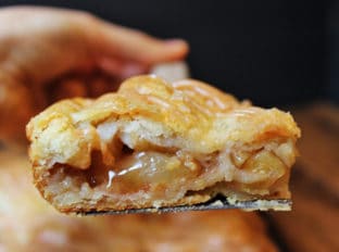 A flaky crust, tender apples, warm spices, it's a delicious handheld pie in slab form, which means you get more crust per bite! It is topped with all the flavors in the pie because it uses all the leftover spiced liquids from the apples!
