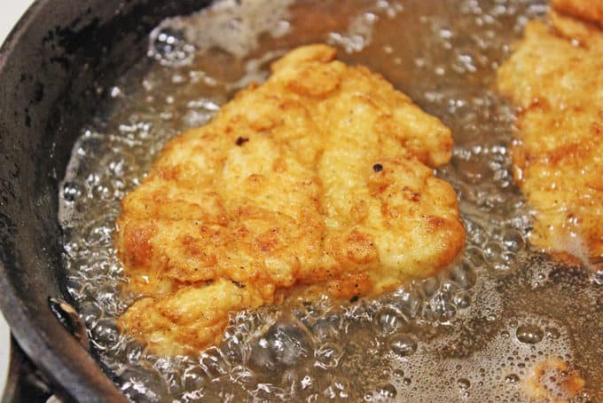 frying chicken in skillet