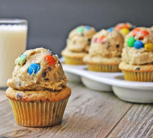 Chocolate Chip Peanut Butter Cupcakes topped with Monster Cream Cheese Cookie Dough Frosting! Full of M&Ms, peanut butter, brown sugar, oats and chocolate chips. Heaven in a bite!