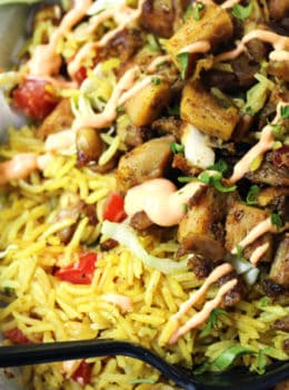 Halal Cart's boldly flavored Middle Eastern Chicken and fragrant Turmeric Rice with a spicy yogurt sauce.