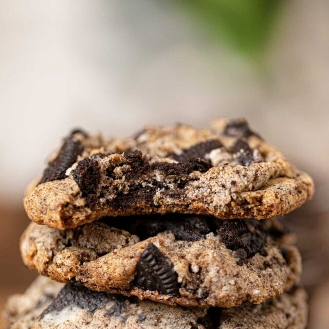 Oreo Chunk Cookies in stack with bite removed