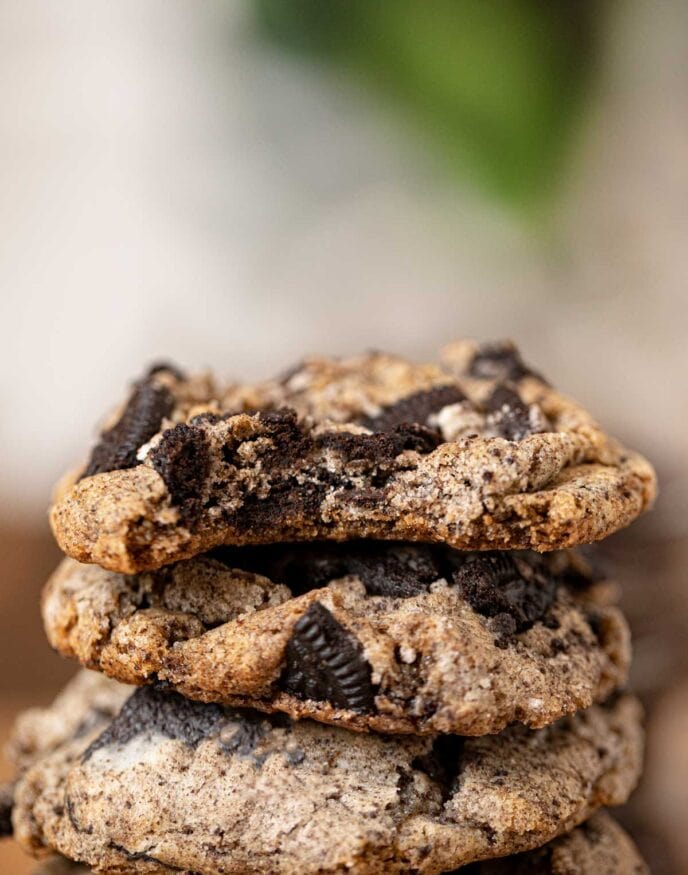 Oreo Chunk Cookies in stack with bite removed