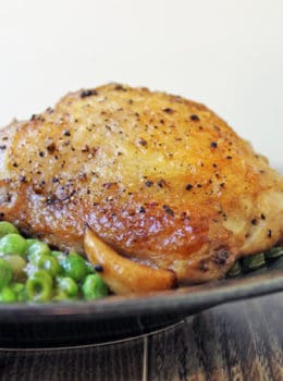 Crispy skinned chicken in a luscious white wine sauce with caramelized garlic and green peas. This is a one pot stove-top meal your family is going to absolutely love!