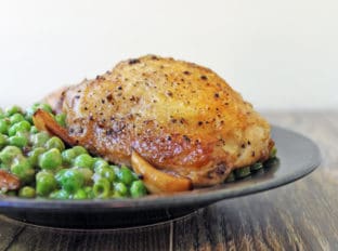 Crispy skinned chicken in a luscious white wine sauce with caramelized garlic and green peas. This is a one pot stove-top meal your family is going to absolutely love!