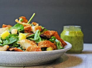 Tropical Macadamia Crusted Chicken on a salad with a Pineapple Jalapeno Vinaigrette and Crispy Wontons. A light summer meal, reminiscent of salads you may eat on a tropical vacation!